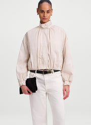 woman wearing off white jacket