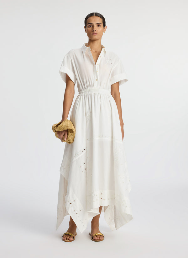 front view of woman wearing white embroidered short sleeve maxi dress