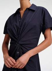 Navy blue shirt with a knot detail on a white background