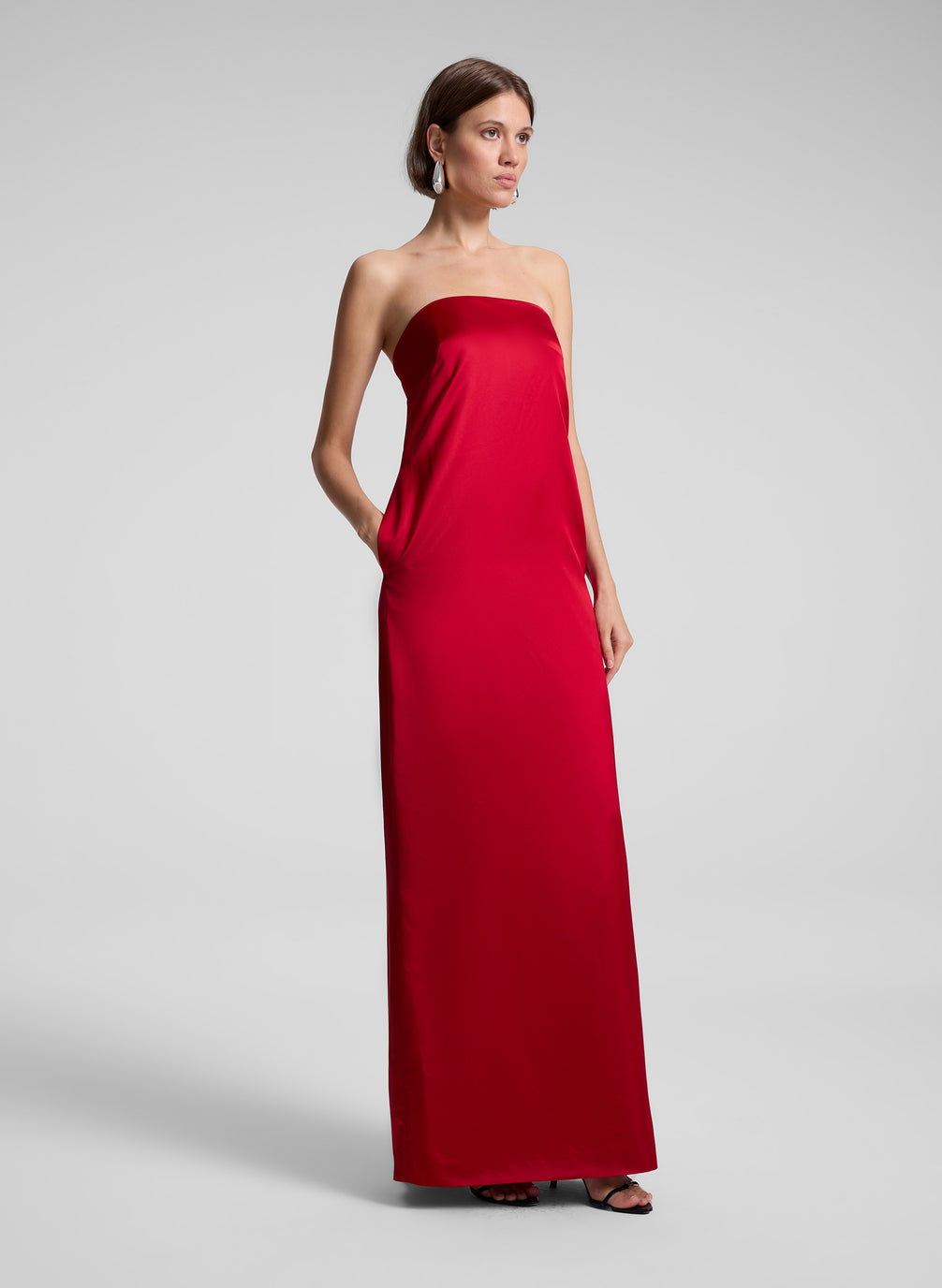 woman wearing red strapless gown