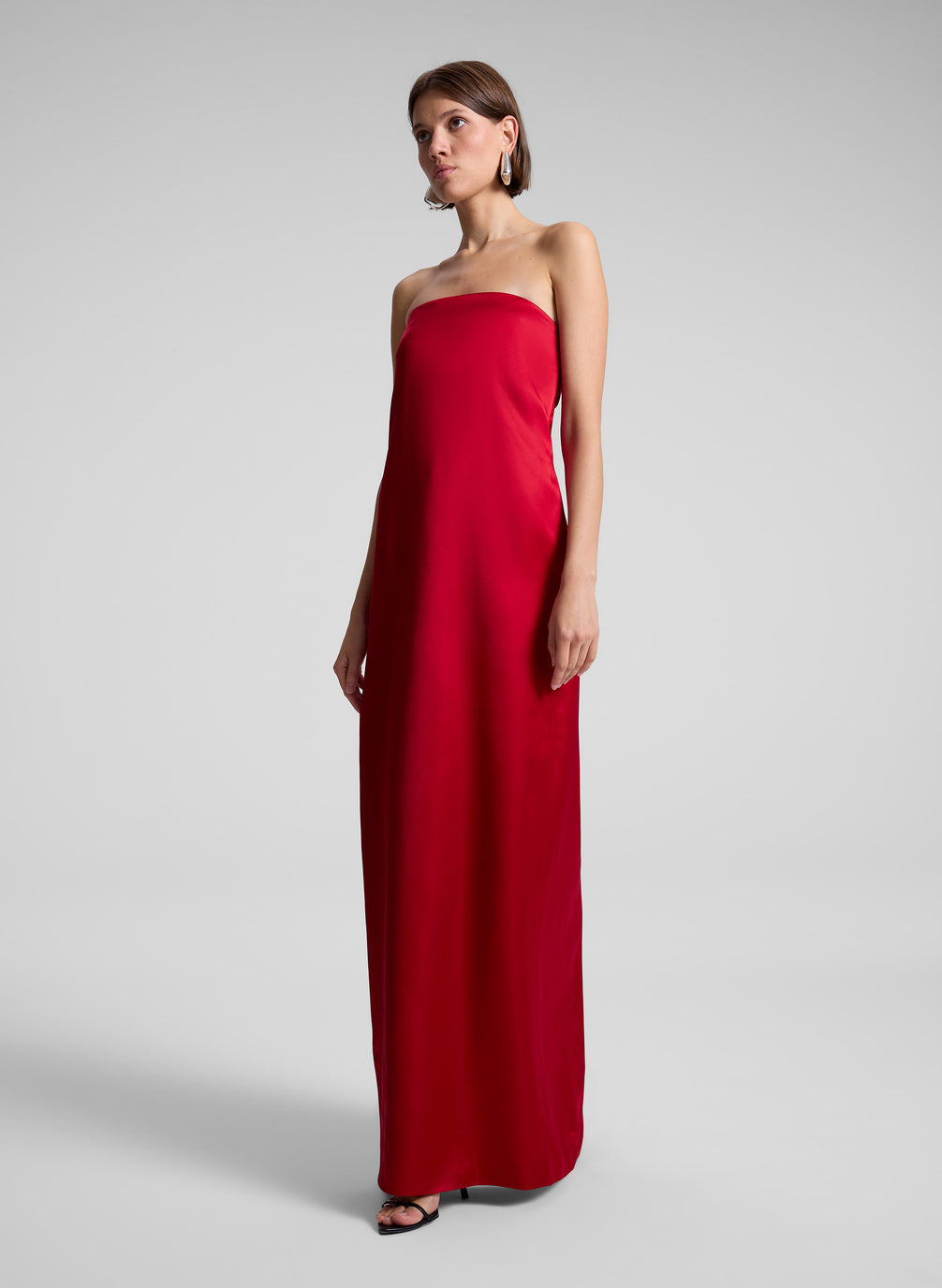 woman wearing red strapless gown