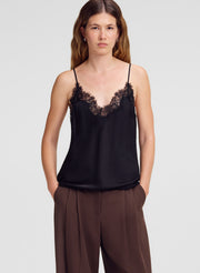 woman wearing black lace trim camisole and brown tailored pants