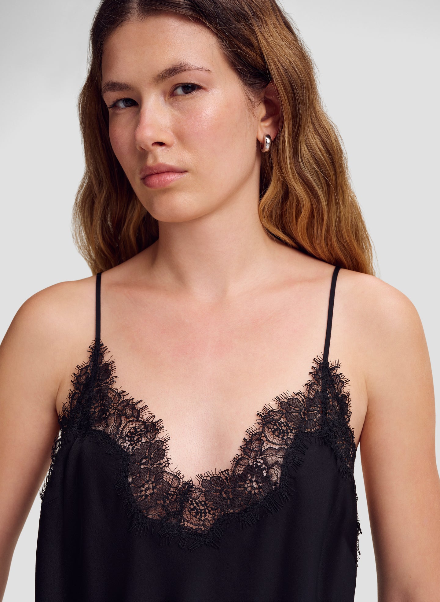 close up of model in black lace trim camisole top
