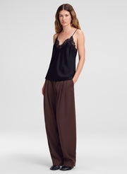 woman wearing black camisole top and brown pants