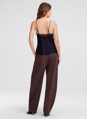 woman wearing black lace trim cami and brown tailored pants
