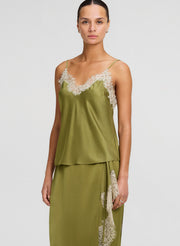 woman wearing green lace trim camisole with matching skirt