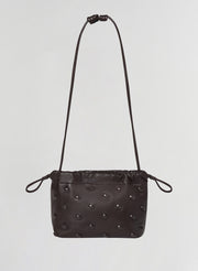brown studded leather handbag