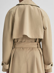 Beige trench coat on a white background