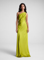 woman wearing green one shoulder maxi dress