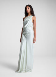 woman wearing green satin one shoulder gown