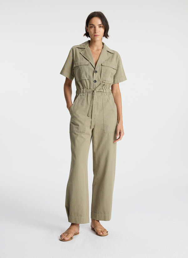 front view of woman in short sleeve khaki jumpsuit