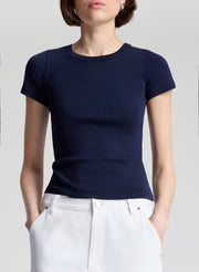 woman wearing navy blue tshirt and white denim jeans