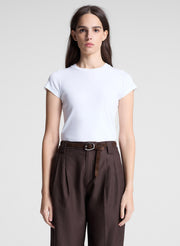 woman wearing white tshirt and brown pants
