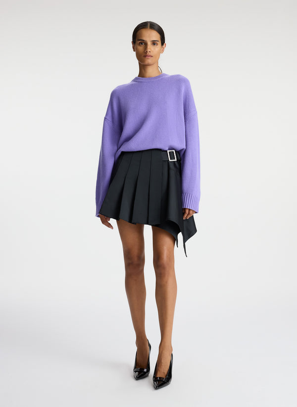 front view of woman wearing light purple cashmere long sleeve sweater