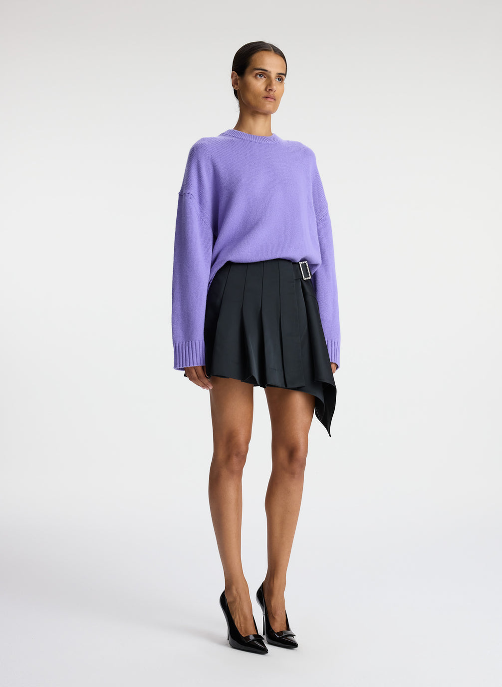 side view of woman wearing light purple cashmere long sleeve sweater