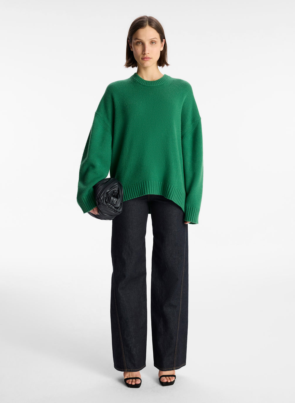 front view of woman wearing green cashmere long sleeve sweater