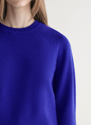 woman wearing bright blue cashmere sweater