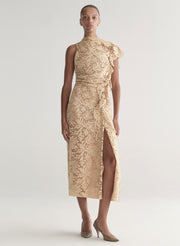Woman wearing a beige lace dress on a white background
