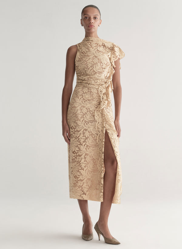 Woman wearing a beige lace dress on a white background