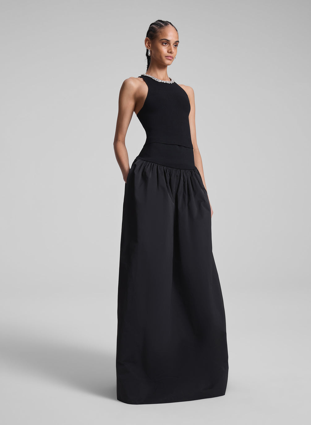 woman wearing black embellished sleeveless top and black maxi skirt