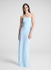 woman wearing light blue pleated strapless maxi dress