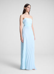 woman wearing light blue pleated strapless maxi dress