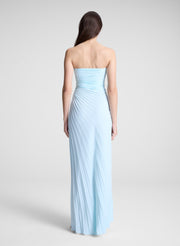woman wearing light blue pleated strapless maxi dress