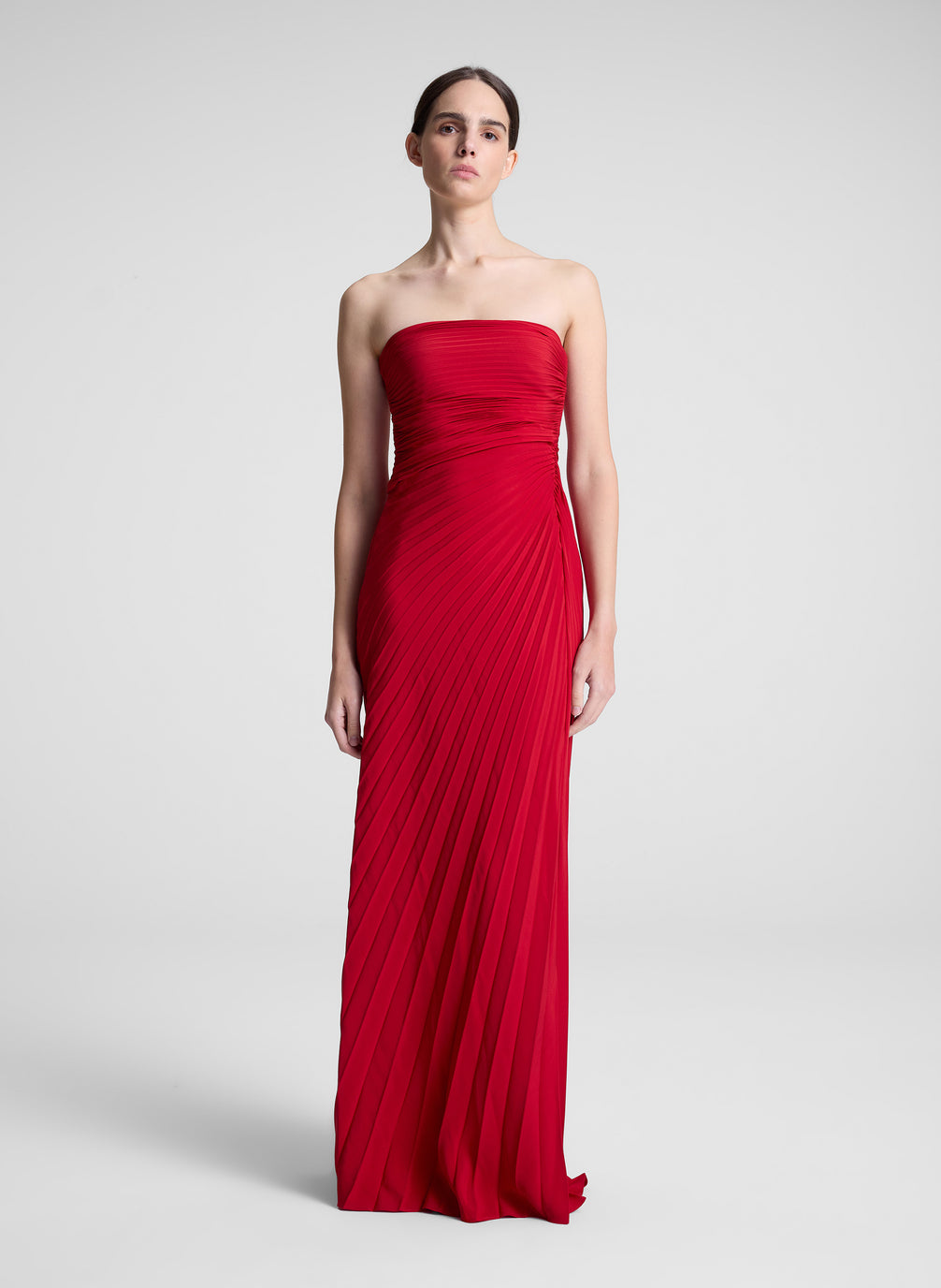 woman wearing red strapless maxi dress