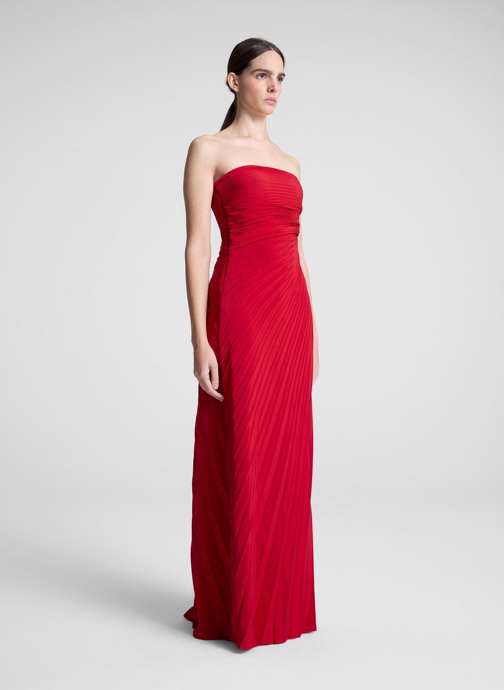 woman wearing red strapless maxi dress