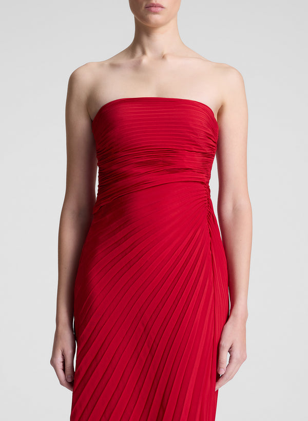 woman wearing red strapless maxi dress