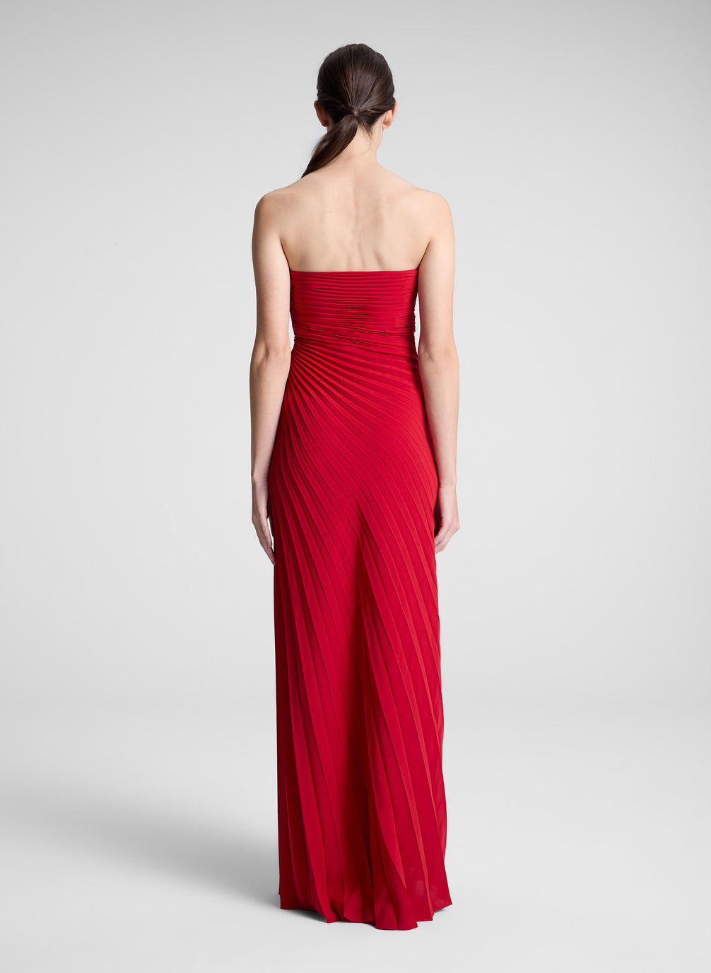 woman wearing red strapless maxi dress