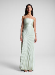 woman in light green strapless pleated maxi dress