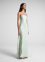 woman in light green strapless pleated maxi dress