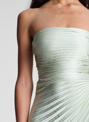 woman in light green strapless pleated maxi dress