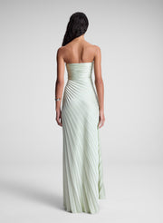 woman in light green strapless pleated maxi dress