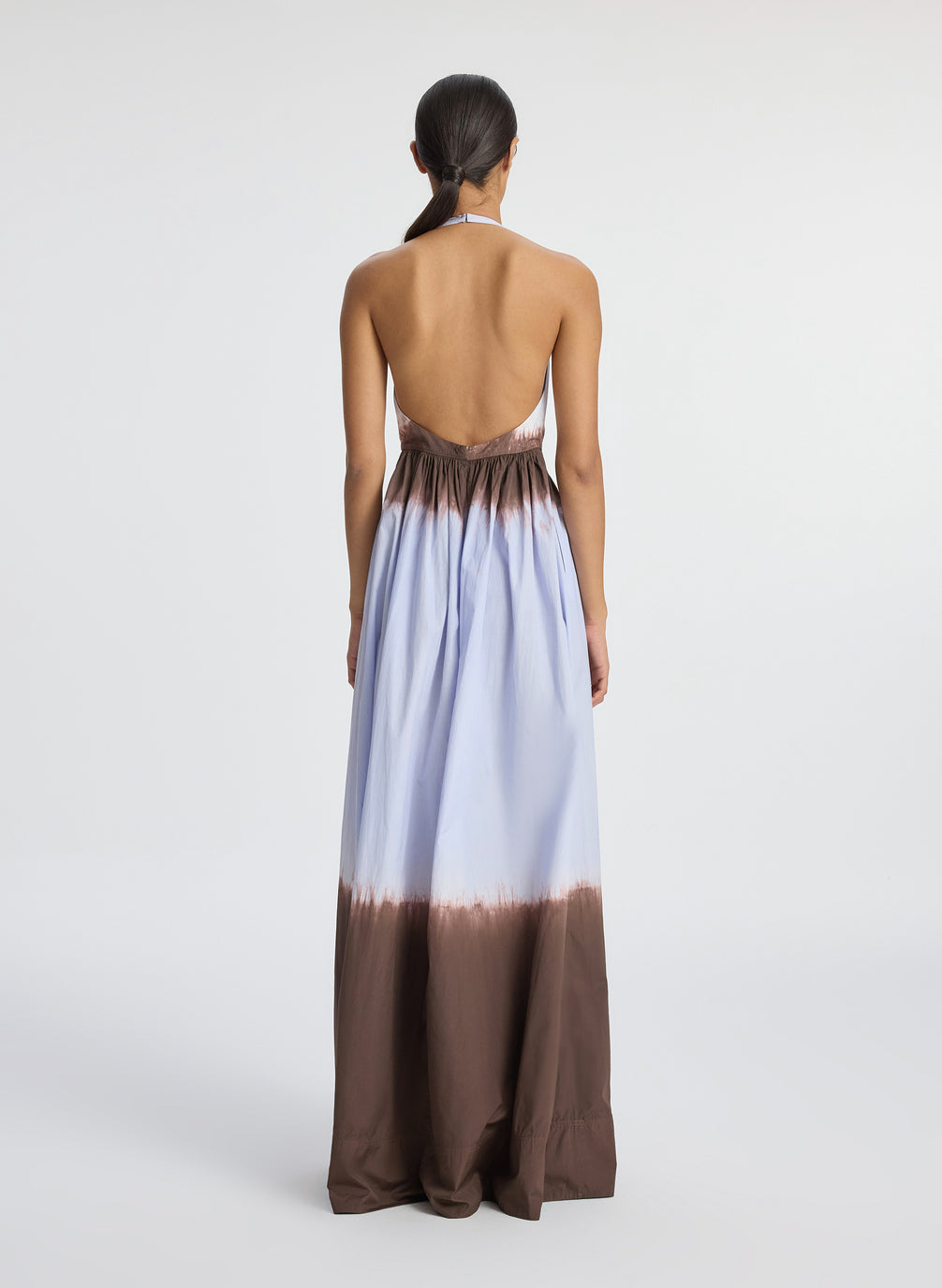 back view of woman wearing dip dye blue and brown sleeveless maxi dress