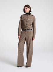 woman wearing brown plaid jacket and matching pant