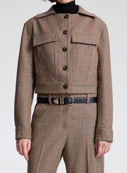 woman wearing brown plaid jacket and matching pant