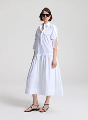 woman wearing white maxi shirtdress