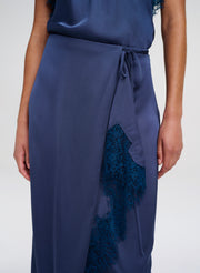 Navy blue skirt with lace detailing on a white background