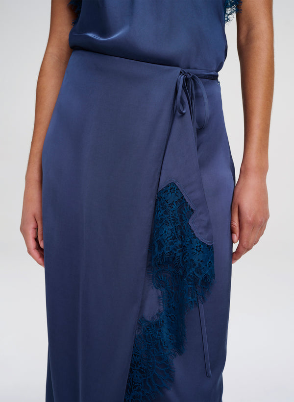 Navy blue skirt with lace detailing on a white background