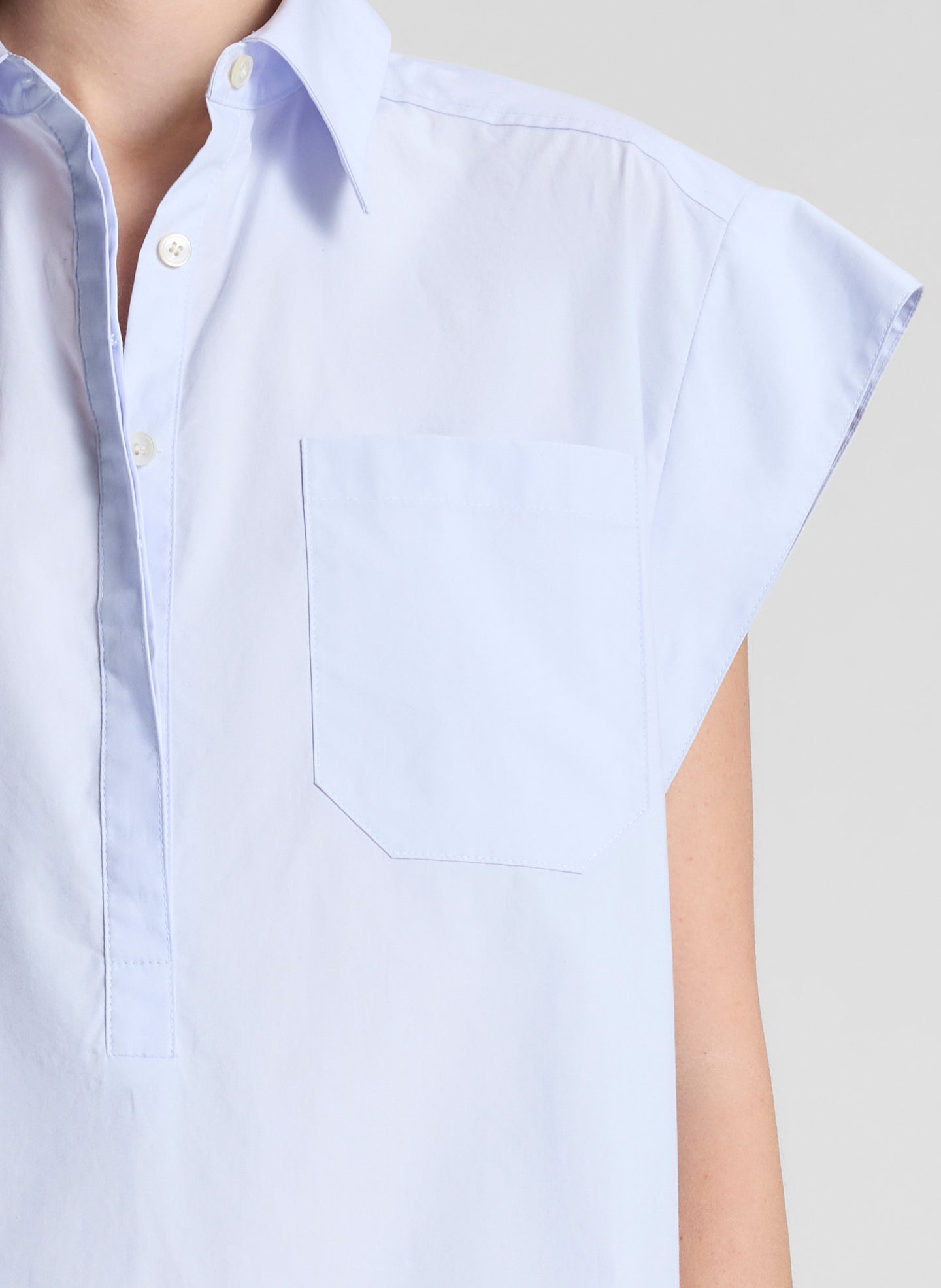 woman wearing light blue drop waist mini dress