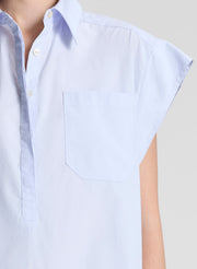 woman wearing light blue drop waist mini dress