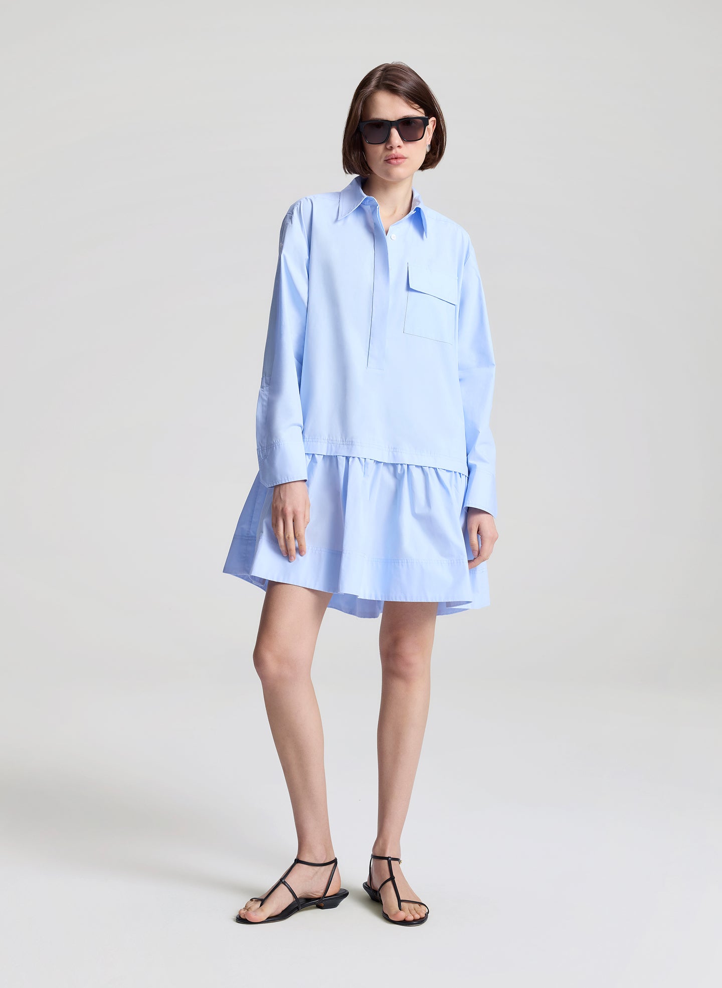 woman wearing light blue mini shirtdress