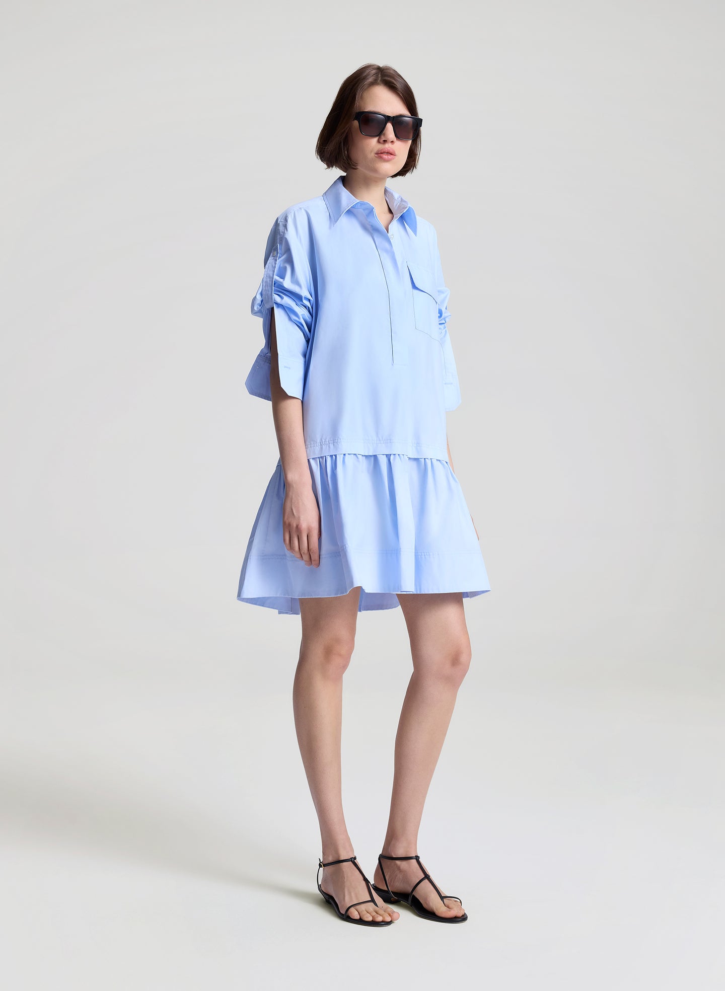woman wearing light blue mini shirtdress