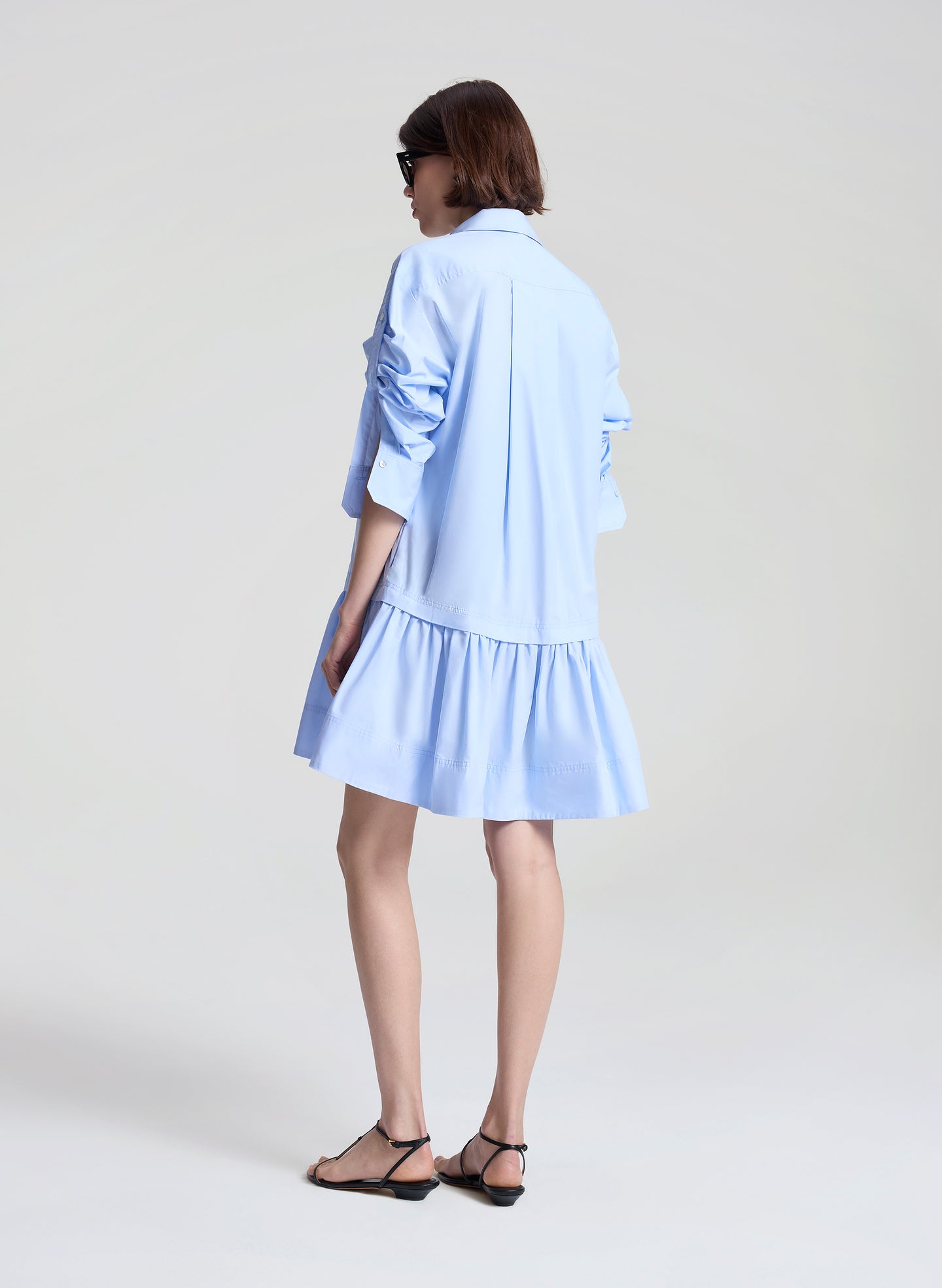 woman wearing light blue mini shirtdress