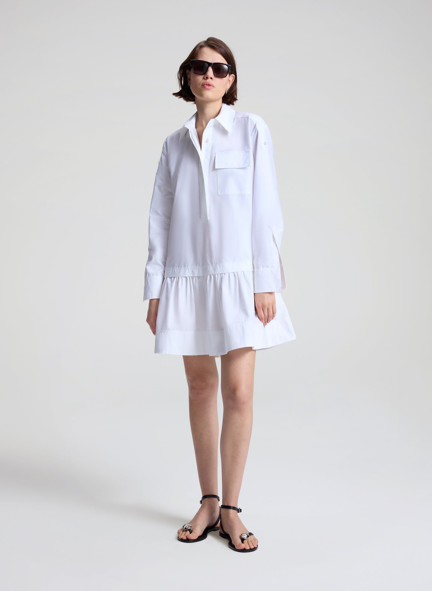 woman wearing white mini shirtdress