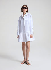 woman wearing white mini shirtdress