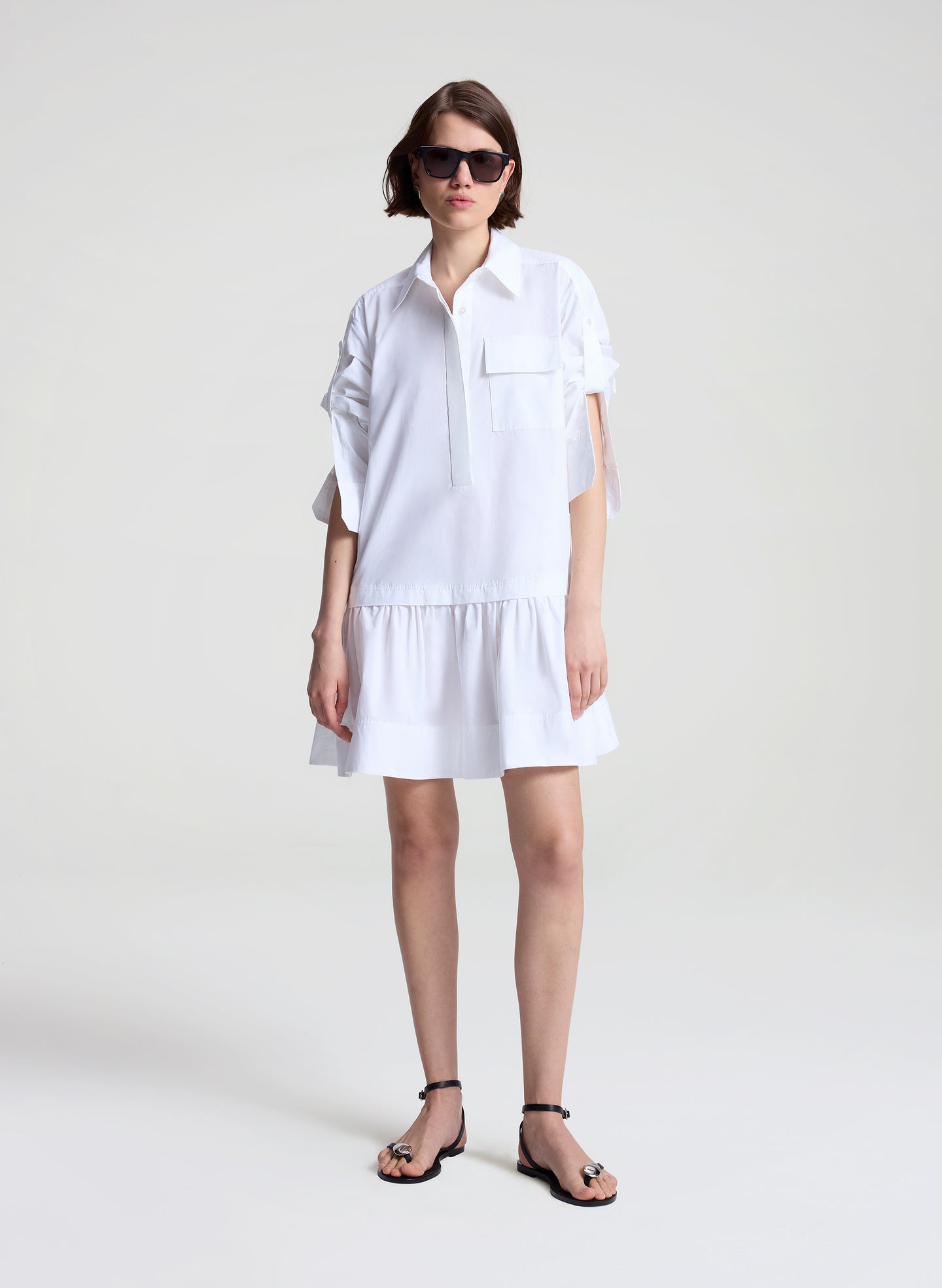 woman wearing white mini shirtdress