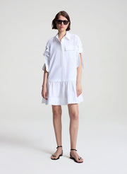 woman wearing white mini shirtdress